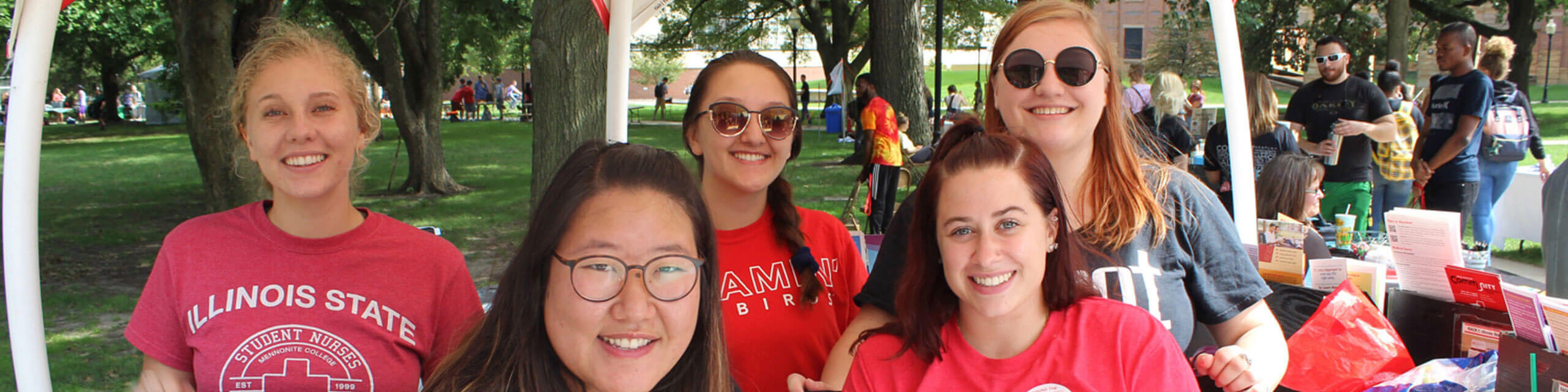 Students smile while working in the Wellness Gazebo.